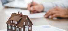real-estate-agent-working-in-his-office-P68S2PN
